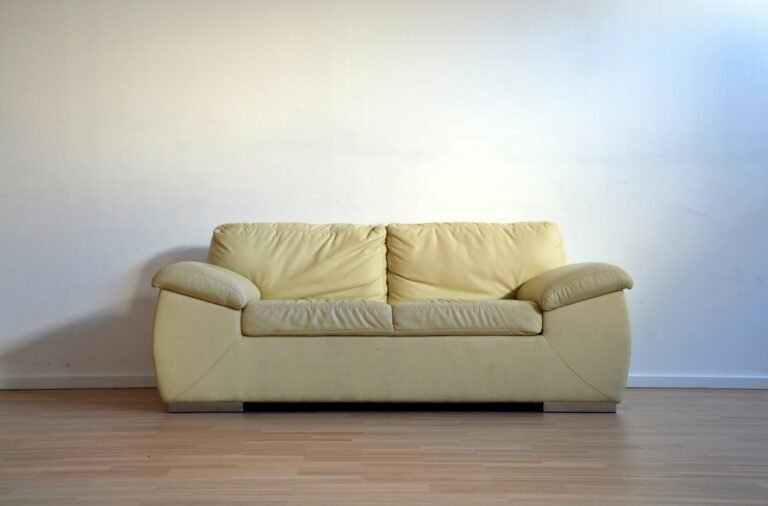Beige leather two-seat sofa representing furniture selection