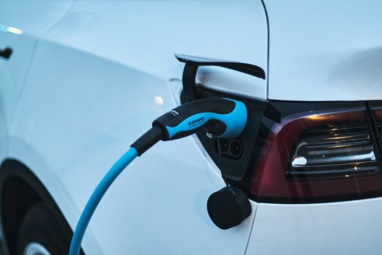 Electric car being charged at a charging station