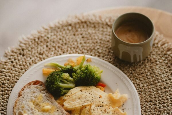 Healthy breakfast with toast, eggs, and vegetables representing daily healthy habits