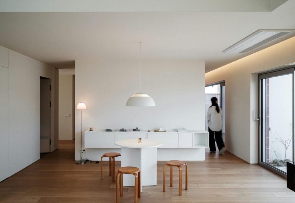 Modern minimalist living room with white furniture