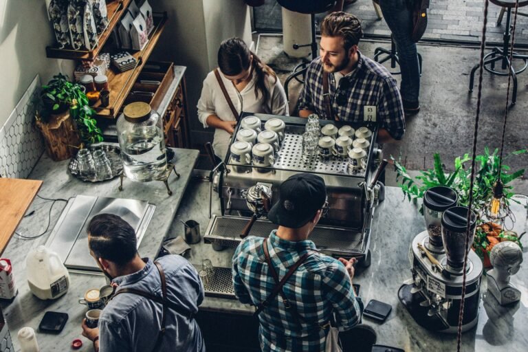 Small business owner at the counter serving a customer