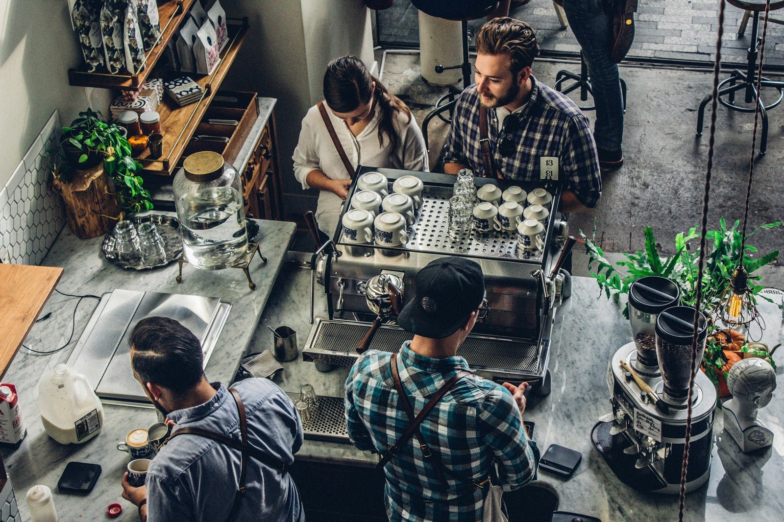 Small business owner at the counter serving a customer