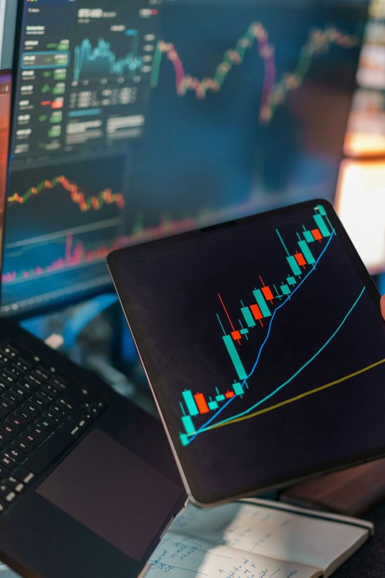 Trading charts displayed on multiple screens representing investment diversification
